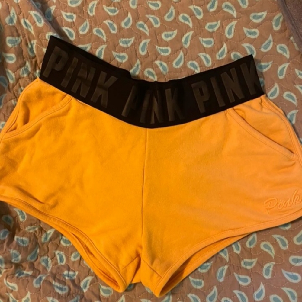 Pink yellow shorts black band size medium